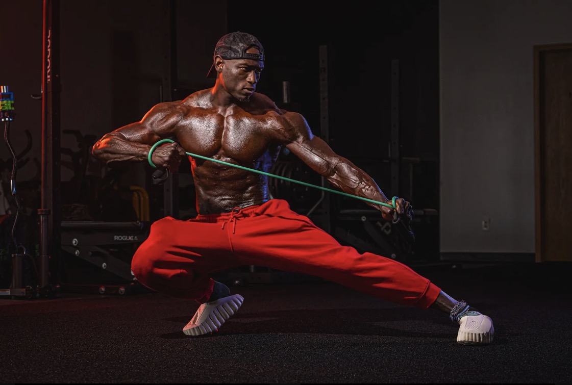 Coach JR training with a resistance band in a deep lateral lunge